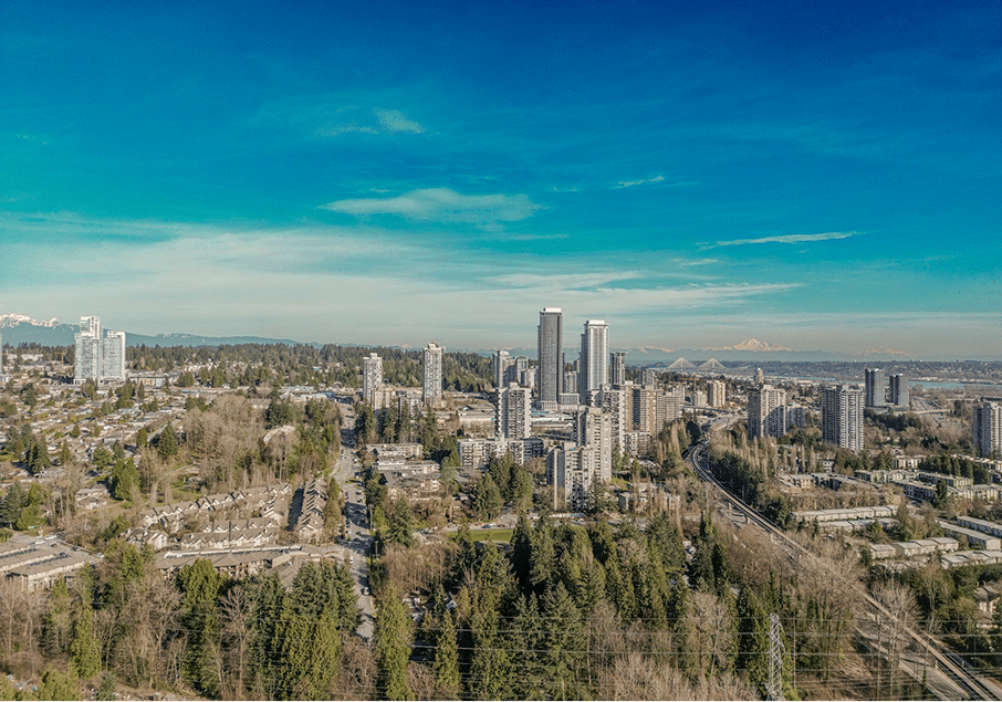 BBX Moving | Commercial Movers – North Vancouver - Aerial view of Burnaby city skyline with tall buildings, lush trees, residential areas, and a clear blue sky—perfect for commercial movers navigating urban landscapes. Aerial view of Burnaby city skyline with tall buildings, lush trees, residential areas, and a clear blue sky—perfect for commercial movers navigating urban landscapes.